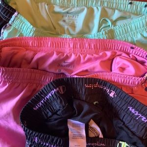 Three pairs of girls size large running shorts
